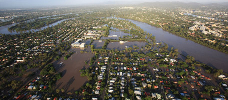 BRISBANE, AUSTRALIA - JANUARY 13: An aerial view of a suburban area flooded along the Brisbane river on January 13, 2011 in Brisbane, Australia. Twelve people have been confirmed dead in towns in the Lockyer Valley and many more are reported missing after devastating floods inundated the region. Evacuations are underway in several towns and suburbs in and around Brisbane with residents and emergency services preparing the worst floods in over 100 years. (Photo by Jonathan Wood/Getty Images)