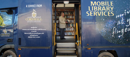 BODMIN, ENGLAND - JANUARY 20: A library user browses for books on the Cornwall County Council mobile library lorry at Rock on January 20, 2011 near Bodmin, England. Offering a valuable resource to many isolated communities and elderly residents - as the coalition government's cuts in public spending begin to be felt - many council funded schemes, such as the mobile library, are under threat of closure. (Photo by Matt Cardy/Getty Images)