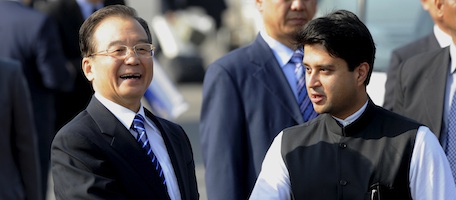 Chinese Prime Minister Wen Jiabao (L) shakes hands with Indian Minister of State for Commerce and Industry Jyotiraditya Scindia (R) arrives at Air Force Station of Palam airport in New Delhi on December 15, 2010. Chinese Premier Wen Jiabao arrived in India at the head of a huge business delegation to try and shore up a relationship undermined by persistent trade and territorial disputes. AFP PHOTO/RAVEENDRAN (Photo credit should read RAVEENDRAN/AFP/Getty Images)