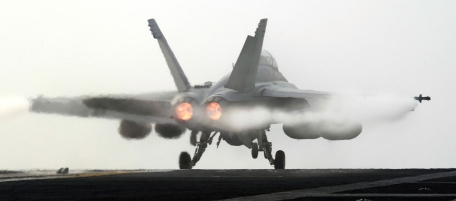 WEST SEA, SOUTH KOREA - NOVEMBER 30: An F/A-18E Super Hornet takes off from the deck of USS George Washington during a joint US and South Korea military exercise on the Korean Peninsula's west sea on November 30, 2010 South Korea. South Korean and American military forces began war games exercises on Sunday. Tensions between the two Koreas remain high following an artillery exchange on the disputed island of Yeonpyeong on November 24. (Photo by Song Kyung-Seok - pool/Getty Images)
