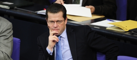 German Defence Minister Karl-Theodor zu Guttenberg takes part in a session of the Bundestag lower house of parliament in Berlin January 28, 2011. Lawmakers approved a 12-month extension of Germany's unpopular Afghanistan mission, but with the proviso for the first time that troops start coming home from the end of 2011 -- if security allows. AFP PHOTO / JOHN MACDOUGALL (Photo credit should read JOHN MACDOUGALL/AFP/Getty Images)