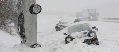 TIM JEAN/Staff photo. I-93 South bound just before Exit 3 in Windam was a mess with a multiple vehicle accident with several cars going over the guard rails and one vehicle coming to a rest upright in the snowbank during the snowstorm on Tuesday morning. February 1, 2011