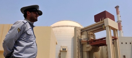An Iranian security man stands outside the reactor building at the Russian-built Bushehr nuclear power plant in southern Iran on August 21, 2010