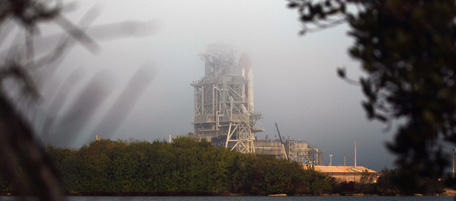 CAPE CANAVERAL, FL - FEBRUARY 23: Fog rolls in as the Space Shuttle Discovery sits on the launch pad at the Kennedy Space Center on February 23, 2011 in Cape Canaveral, Florida. As the Shuttle Program winds down, Space Shuttle Discovery is set to launch on its last mission to the International Space Station on February 24, 2011 after technical issues postponed its original launch date. (Photo by Joe Raedle/Getty Images)
