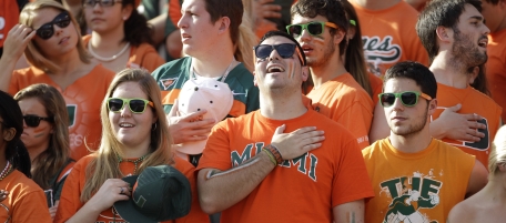 Miami fans stand for the national anthem during an NCAA college football game against Virginia Tech in Miami, Saturday, Nov. 20, 2010. (AP Photo/Lynne Sladky)