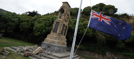 The New Zealand national flag flies at half-mast as a sign of national mourning in the port town of Lyttelton on February 25, 2011 -- the epicentre of the 6.3 earthquake which devastated the city of Christchurch on February 22. The quake caused more damage than more the 7.1 magnitude quake that hit the city on September 4, 2010 and there are reports of 113 deaths with another 200 listed as missing. AFP PHOTO / Torsten BLACKWOOD (Photo credit should read TORSTEN BLACKWOOD/AFP/Getty Images)