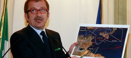Italian Interior Minister Roberto Maroni shows the map of an operation that shipped more than 200 migrants who had been rescued in the Mediterranean Sea back to Libya, at a press conference in Rome, Thursday May 7, 2009. Authorities based on the tiny Sicilian island of Lampedusa, told The Associated Press that 227 migrants were sent back to Tripoli aboard two coast guard boats as well as a border police boat. Italy contends the migrants had set out in smugglers' boats from Libyan shores. Maroni, speaking on private Italian Canale 5 TV, praised Libya's acceptance of the migrants as a possible "turning point" in the crackdown on illegal immigration. (AP Photo/Sandro Pace)