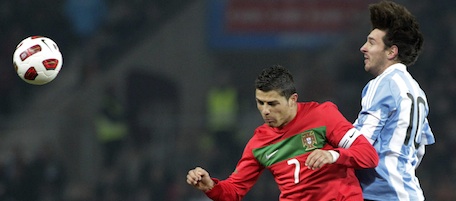 Portugal's Cristiano Ronaldo, left,challenges for the ball with Argentina's Lionel Messi, right, during friendly soccer match between Portugal and Argentina at the Stade de Geneve stadium, in Geneva, Switzerland, Wednesday, Feb. 9, 2011. (AP Photo/Keystone/Salvatore Di Nolfi)