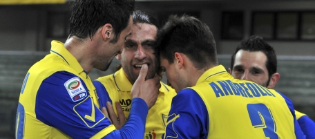 Chievo's Davide Moscardelli, center, is congratulated by his teammates after scoring during a Serie A soccer match against Napoli at Bentegodi stadium in Verona, Italy, Wednesday, Feb. 2, 2011. (AP Photo/Felice Calabro')