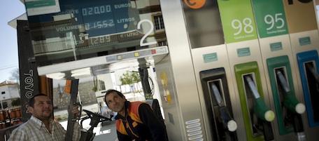A man fills up a car at a oil station in Olvera, near Cadiz, on February 25, 2011 in southern Spain. The price per litre of gasoline has reached an all-time high. Spain announced today a series of energy saving measures, including cuts to the speed limit and lower prices for train tickets, in response to the rise in world oil prices due to unrest in the Middle East. AFP PHOTO/ JORGE GUERRERO (Photo credit should read Jorge Guerrero/AFP/Getty Images)