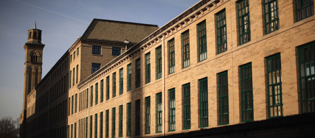 BRADFORD, ENGLAND - FEBRUARY 08: A general view of the mill built by Sir Titus Salt at Saltaire Village World Heritage Site in Bradford, West Yorkshire on February 8, 2011 in Bradford, England. Saltaire is named after Sir Titus Salt who built a textile mill and housing for his workers on the banks of the River Aire. In 2001 the historic industrail village was granted a World Heritage Site by UNESCO. Titus Salt (1803-1876) became one of Britain's most successful industrialists. A deeply religous man who believed in education and a healthy environment for his employees. It took 25 years to build the village and mill producing his top quality cloths and became a town planning model for many cities across the world. (Photo by Christopher Furlong/Getty Images)