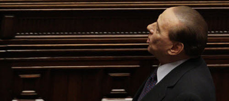 In this picture taken Wednesday, Jan. 26, 2011, Italian Premier Silvio Berlusconi leaves after winning a confidence vote at the Lower Chamber, in Rome. Berlusconi has issued, Friday, Jan. 28, 2011, another denunciation of Milan prosecutors who are investigating whether he paid for sex with a 17-year-old runaway by saying he deserves to be premier and will fight to remain so "in the interest of the country.'' (AP Photo/Andrew Medichini)
