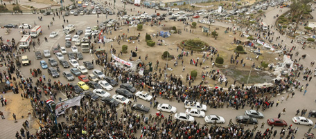 A general view shows crowds and traffic at Cairo's Tahrir Square, the epicentre of the popular revolt that drove veteran strongman Hosni Mubarak from power, as people camping out in the square pack and leave on February 13, 2011. AFP PHOTO/MOHAMMED ABED (Photo credit should read MOHAMMED ABED/AFP/Getty Images)