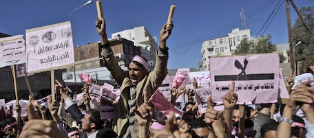 Yemeni demonstrators chant slogans during a rally calling for an end to the government of President Ali Abdullah Saleh, in Sanaa, Yemen, Thursday, Jan. 27, 2011. Tens of thousands of people are calling for the Yemeni president's ouster in protests across the capital inspired by the popular revolt in Tunisia. The demonstrations led by opposition members and youth activists are a significant expansion of the unrest sparked by the Tunisian uprising, which also inspired Egypt's largest protests in a generation. Banner reads:'Together lets break the ruling party'. (AP Photo/Hani Mohammed)
