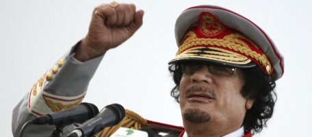 Libyan leader Moammar Gadhafi talks during a ceremony to mark the 40th anniversary of the evacuation of the American military bases in the country, in Tripoli, Saturday, June 12, 2010. (AP Photo/ Abdel Magid Al Fergany)
