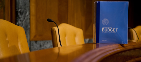 US President Barack Obama's budget sits on a table after being unpacked by aides of the Senate Buget Committee on Capitol Hill in Washington, DC, February 14, 2011. Obama unveils his 2012 budget Monday, proposing a raft of spending cuts and tax hikes aimed at curbing a record budget deficit. Facing a projected $1.65 trillion budget shortfall this year -- an all-time high -- Obama plans to trim $90 billion from government spending in 2012, while dramatically boosting tax revenues, senior administration officials said. Addressing widespread public fear that the government is spending far more than it should, the administration will vow to cut the deficit by more than one trillion dollars over the next 10 years. AFP PHOTO/Jim WATSON (Photo credit should read JIM WATSON/AFP/Getty Images)