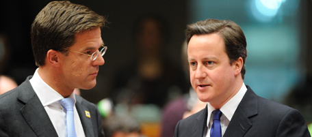 British Prime Minister David Cameron (L) talks with Dutch Prime Minister Mark Rutte prior to a working session of an extraordinary EU summit focused on Libya, on March 11, 2011 at the European Council headquarters in Brussels. The leaders of the 27-nation European Union will examine the prospects for military intervention via a no-fly zone, humanitarian aid and economic measures. AFP PHOTO / ERIC FEFERBERG (Photo credit should read ERIC FEFERBERG/AFP/Getty Images)