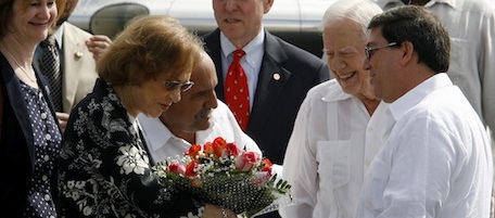 Former President Jimmy Carter, second from right, and his wife Rosalynn Carter, second from left, are welcomed by Cuba's Foreign Minister Bruno Rodriguez, right, and an unidentified protocol official upon their arrival to the Jose Marti airport in Havana, Cuba, Monday, March 28, 2011. Carter arrived in Cuba to discuss economic policies and ways to improve Washington-Havana relations, which are even more tense than usual over the imprisonment of a U.S. contractor on the island. (AP Photo/Ismael Francisco, Prensa Latina)