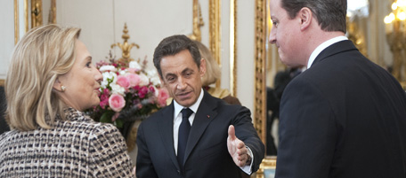France's president Nicolas Sarkozy (C) speaks with British Prime minister Davd Cameron (R) US Secretary of State Hillary Clinton (2ndL) and France Prime Francois Fillon (L) on March 19, 2011, before a summit at the Elysee Palace in Paris, on implementing the UN Security Council resolution 1973 authorising military action in Libya, to be attended by representatives of the European Union, the Arab League, the African Union, the UN and other leaders. A senior French envoy predicted military action against Libyan leader Moamer Kadhafi's forces within hours of the summit. The United States has also declared that Kadhafi is in breach of a UN Security Council resolution which ordered an immediate ceasefire. AFP PHOTO POOL LIONEL BONAVENTURE (Photo credit should read LIONEL BONAVENTURE/AFP/Getty Images)