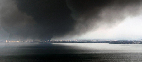 Black thick smokes cover the sky over Tagajo, Miyagi, northern Japan Saturday, March 12, 2011 after Japan's biggest recorded earthquake slammed into its eastern coast Friday. (AP Photo/Kyodo News) MANDATORY CREDIT, NO LICENSING ALLOWED IN CHINA, HONG KONG, JAPAN, SOUTH KOREA AND FRANCE