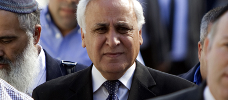Former Israeli president Moshe Katsav (C) arrives at the district court in Tel Aviv on March 22, 2011 to hear the verdict after his conviction on two counts of rape and other sexual assault charges. AFP PHOTO/JACK GUEZ (Photo credit should read JACK GUEZ/AFP/Getty Images)