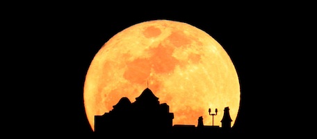 The moon rises behind Century Tower at the University of Florida as seen from Ben Hill Griffin Stadium in Gainesville Fl. on Saturday, March 19, 2011. The full moon is at its closest point to the Earth since March 1993. (AP Photo by Matt Stamey/The Gainesville Sun)