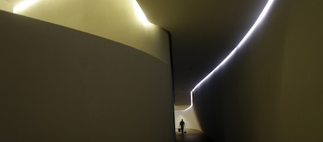 A worker walks through one of the corridors that spirals into the next floor at the Soumaya Museum's new home in Mexico City, Tuesday March 1, 2011. The new building, which will be inaugurated Tuesday evening by Mexico's President Felipe Calderon and opened to the general public on March 29, will house Mexican billionaire Carlos Slim's fast-growing art collection. (AP Photo/Dario Lopez-Mills)