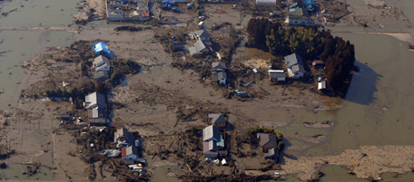 A residential area remains in flood in Sendai, northern Japan, Saturday, March 12, 2011. Japan launched a massive military rescue operation Saturday after a giant, quake-fed tsunami killed hundreds of people and turned the northeastern coast into a swampy wasteland, while authorities braced for a possible meltdown at a nuclear reactor. (AP Photo/Itsuo Inouye)