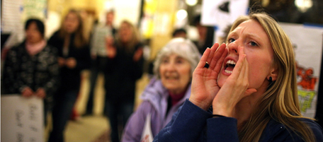 MADISON, WI - MARCH 04: A demonstrator leads a chant as pro-union activists protest inside the Wisconsin State Capitol on March 4, 2011 in Madison, Wisconsin. Some demonstrators have returned to the capitol building hours after they were forced to vacate the building they occupied for more than two weeks in protest against Governor Scott Walker's attempt to push through a bill that would restrict collective bargaining for most government workers in the state. (Photo by Justin Sullivan/Getty Images)