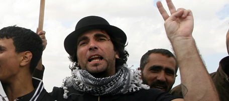This photo taken on March 18, 2010 shows a foreign peace activist Vittorio Arrigoni as he takes part in a protest against an Israeli decision to tighten the border area in Khan Yunis, south of the blockaded strip. Vittorio Arrigoni was found dead early on April 15 morning, after a Salafist group posted a video of him online and threatened to kill him unless an unspecified number of their members were released by Gaza rulers Hamas. His kidnappers identified themselves as belonging to a previously unknown group called The Brigade of the Gallant Companion of the Prophet Mohammed bin Muslima. The pro-Palestinian International Solidarity Movement said on today they were disraught at news that an Italian member had been found murdered in the Gaza Strip. AFP PHOTO/ SAID KHATIB (Photo credit should read SAID KHATIB/AFP/Getty Images)