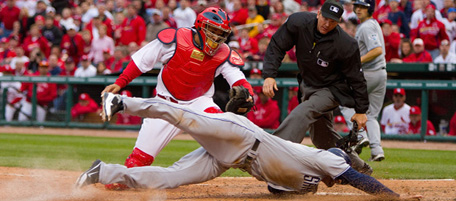 ST. LOUIS, MO - MARCH 31: Chase Headley #7 of the San Diego Padres scores the game-winning run against Yadier Molina #4 of the St. Louis Cardinals as umpire Jeff Kellogg #8 on opening day at Busch Stadium on March 31, 2011 in St. Louis, Missouri. (Photo by Dilip Vishwanat/Getty Images) *** Local Caption *** Chase Headley;Yadier Molina;Jeff Kellogg