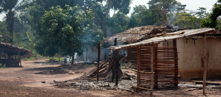 Picture taken on March 29, 2011 shows damaged houses in Duekoue, in western Ivory Coast, following clashed between forces loyal to internationally recognised Ivory Coast president Alassane Ouattara and his rival's troops. Forces backing Ivory Coast's recognised president Alassane Ouattara today approached the capital Yamassoukrou on Wednesday in a vast offensive to seize control after a disputed election. After seizing four strategic towns across the country on Tuesday, Ouattara's Republican Forces army continued a push south as under-fire strongman Laurent Gbagbo sought to boosted his army with thousands of new recruits in Abidjan.
AFP PHOTO/ ZOOM DOSSO (Photo credit should read ZOOM DOSSO/AFP/Getty Images)