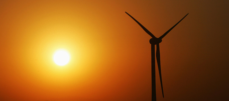 BEIJING - DECEMBER 13: A wind turbine is seen in sunset on the south bank of Guanting Reservoir on December 13, 2007 in Beijing, China. Beijing has put forward "Green Olympics" as one of the three themes for 2008 Olympic Games. As the first large-scale wind power field of Beijing, Guanting Wind Power Field that will operate at the end of this month have 33 wind turbines with a capacity of 50,000 kw, according to the local media. China has accelerated its development of wind resources and other clean energy to meet its vast long-term energy needs, and help to achieve the "Green Olympic" goal. (Photo by Feng Li/Getty Images)