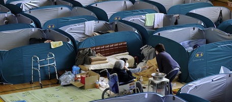 This image shows evacuees living in partitioned "rooms" at a shelter in Kamaishi in Iwate prefecture on April 12, 2011 a month after the March 11 earthquake and tsunami hit the northeastern coast of Japan. Japan upgraded its nuclear emergency to a maximum seven on an international scale of atomic crises on April 12, the first time the highest ranking has been invoked since the Chernobyl disaster in 1986. AFP PHOTO / KAZUHIRO NOGI (Photo credit should read KAZUHIRO NOGI/AFP/Getty Images)