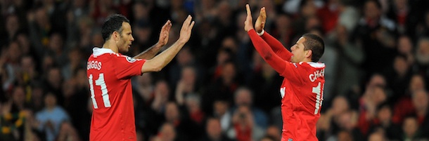 Manchester United's Welsh midfielder Ryan Giggs (L) congratulates goal scorer Manchester United's Mexican forward Javier Hernandez during the UEFA Champions League quarter final second leg football match between Manchester United and Chelsea at Old Trafford in Manchester, north west England, on April 12, 2011. AFP PHOTO/ANDREW YATES (Photo credit should read ANDREW YATES/AFP/Getty Images)