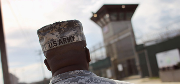 GUANTANAMO BAY, CUBA - SEPTEMBER 15: (EDITORS NOTE: Image has been reviewed by the U.S. Military prior to transmission.) A U.S. Army soldier approaches the U.S. detention center for "enemy combatants" on September 15, 2010 in Guantanamo Bay, Cuba. With attempts by the Obama administration to close the facility stalled, more than 170 detainees remain at the detention center. The facility is run by the Joint Task Force Guantanamo, located on the U.S. Naval Station at Guantanamo Bay, which is the oldest American naval base outside of the continental United States. (Photo by John Moore/Getty Images)