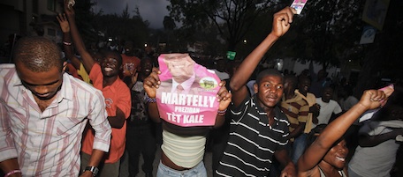 PETIONVILLE, HAITI - APRIL 4: Supporters of Michel "Sweet Micky" Martelly celebrate his victory in the Haitian presidential election April 4, 2011 in Petionville, Haiti. Results from the March 20 run-off election were announced today with Martelly defeating former First Lady Mirlande Manigat. (Photo by Lee Celano/Getty Images)