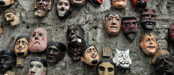 Wooden masks are offered to tourists at a handicrafts market in Antigua Guatemala, some 50 km west of Guatemala City, on April 23, 2011. AFP PHOTO/JOHAN ORDONEZ (Photo credit should read JOHAN ORDONEZ/AFP/Getty Images)