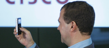 Russian President Dmitry Medvedev uses a Cisco Flip Camera during a tour of Cisco headquarters in San Jose, Calif., Wednesday, June 23, 2010. Medvedev is in California for a two-day visit to Silicon Valley. (AP Photo/Paul Sakuma)