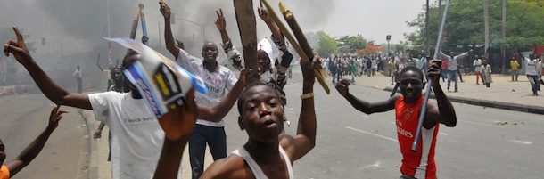 Youthes raise wooden and metal sticks as running battles broke out between protesters and soldiers in Nigeria's northern city of Kano, on April 18, 2011 after President Goodluck Jonathan headed for an election win. Protesting youths challenged soldiers deployed to the streets, who sought to push them back. AFP PHOTO / SEYLLOU (Photo credit should read SEYLLOU DIALLO/AFP/Getty Images)