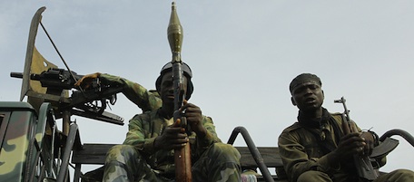 Pro-Ouattara fighters of the FRCI (Republican Force of Ivory Coast), one of them with a RPG grenade launcher, prepare for the so-called "final assault" in front of the Golf Hotel in Abidjan on April 5, 2011. Ivory Coast strongman Laurent Gbagbo is hunkered down in a bunker at his residence in Abidjan, after calling for a ceasefire as rival forces cornered him, the UN mission said. AFP PHOTO/ STR (Photo credit should read STR/AFP/Getty Images)