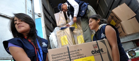 Peruvian National Office of Electoral Processes (ONPE) employees unload electoral material at a polling station in Lima on April 9, 2011, in advance of the presidential and general elections of April 10. AFP PHOTO/CRIS BOURONCLE (Photo credit should read CRIS BOURONCLE/AFP/Getty Images)
