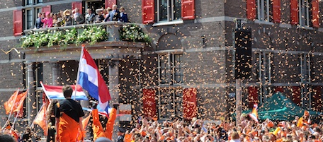 Netherlands' Queen Beatrix, reacts on a balcony surrounded by her family during festivities marking Queen's Day in Weert, southern Netherlands, Saturday April 30, 2011. The Dutch celebrate Queen's Day, a Dutch national holiday marking the birthday of the Queen's mother. (AP Photo/Ermindo Armino)