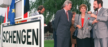 SCHENGEN, LUXEMBOURG - JUNE 19: French minister for European affairs Edith Cresson (C) is flanked by Luxemburg's G. Wohlfahrt (D) and Belgium's Keersmaeker (L) in Schengen the day of the signature of the Schengen Agreement, 19 June 1990. Belgium, France, Luxemburg, the Netherlands and West Germany signed the agreement aimed at bringing about open borders by mid-1992. (Photo credit should read CHARLES CARATINI/AFP/Getty Images)