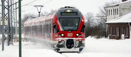 A train rides on a snowed in rail track in Altefaehr on the Baltic Sea island Ruegen, northern Germany on January 31, 2010. An icy cold snap that has caused transport chaos throughout Germany will also take a significant toll on the economy, Europe's largest, a top economic institute warned on January 31, 2010. AFP PHOTO DDP/ JENS KOEHLER GERMANY OUT (Photo credit should read JENS KOEHLER/AFP/Getty Images)