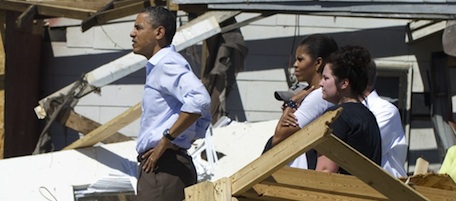 US President Barack Obama tours tornado damage alongside First Lady Michelle Obama (2nd R) in Tuscaloosa, Alabama, April 29, 2011. Obama on Friday walked through piles of splintered debris in Alabama, pledging to help rebuild American communities after the worst US tornadoes in decades killed 300 people.With grief and disbelief rippling across the region, stunned residents sifted through the rubble of their destroyed homes and emergency crews searched for survivors, especially in hardest-hit Alabama where at least 210 people died and cities and towns were left forever transformed by nature's fury. AFP PHOTO / Saul LOEB (Photo credit should read SAUL LOEB/AFP/Getty Images)