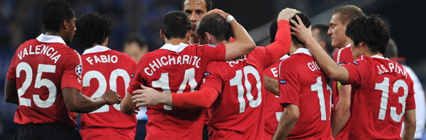 Manchester's Welsh midfielder Ryan Giggs (3rd R) celebrates with teammates after scoring the 01 during the Champions League semi-final, first-leg match of Schalke 04 against Manchester United on April 26, 2011 in Gelsenkirchen, western Germany. Manchester United won the match 0-2. AFP PHOTO / PATRIK STOLLARZ (Photo credit should read PATRIK STOLLARZ/AFP/Getty Images)
