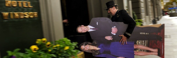 TO GO WITH Britain-royals-marriage-Australia FOCUS by Amy Coopes
In a picture taken on April 22, 2011 Russell Wilson, doorman at the Hotel Windsor, carries a life-size cutout of Prince William and Kate Middleton to replace the orginal cutout that was stolen from the hotel, in Melbourne. Thieves made off with a life-size cutout of Prince William and his bride in a midnight heist which was being used an advertisement for the luxury hotel's "Royal Wedding Package", offering one night and a champagne breakfast in a "stately" Victorian suite. The upcoming royal wedding has Australia's royalists and republicans in rare and unlikely agreement -- the monarchy is digging in Down under. AFP PHOTO/William WEST (Photo credit should read WILLIAM WEST/AFP/Getty Images)