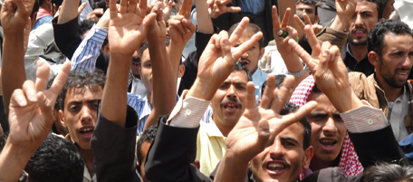 Protesters flash the V-sign during a demonstration calling for an end to the regime of President Ali Abdullah Saleh in Yemen's Ibb province, 190 km southwest of the capital Sanaa, on April 15, 2011, a day after influential tribal and religious chiefs abandoned the increasingly isolated president. Saleh stood defiant as Yemen's elected leader in a speech to his supporters today despite a growing list of desertions and mounting pressure on him to resign. AFP PHOTO/STR (Photo credit should read STR/AFP/Getty Images)
