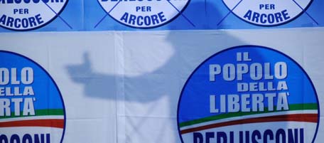 A picture taken on May 9, 2011 shows the shadow of Italian Prime Minister Silvio Berlusconi speaking during an rally of his party the "People of Liberty" for communal elections in Arcore. AFP PHOTO / OLIVIER MORIN (Photo credit should read OLIVIER MORIN/AFP/Getty Images)